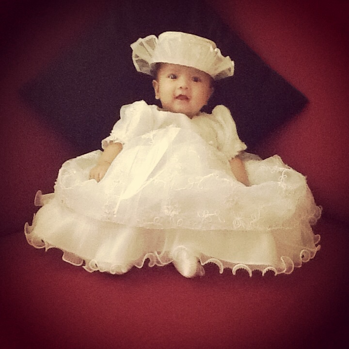 Looking classy on her Baptismal dress (thanks to grandma Merlie)