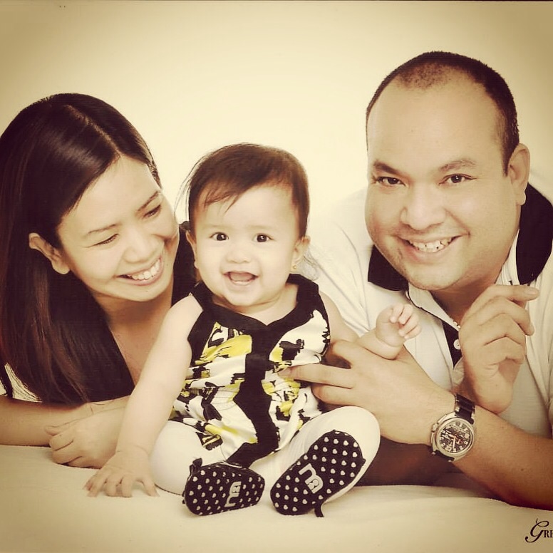 with Mommy and Daddy on her 8th month, wearing Twilo Mom&Me dress